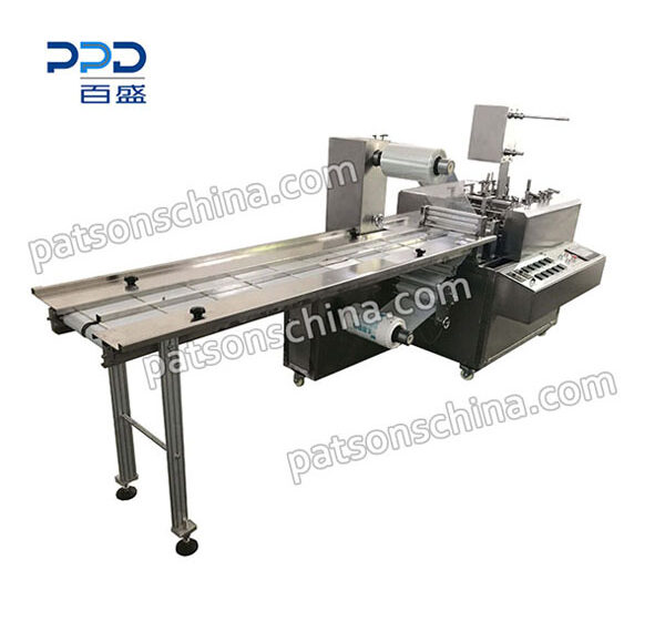 Four side seal glove packaging machine